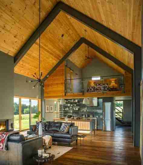 Tall vaulted ceilings with beams in a barndominium