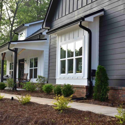 North Georgia home with landscaping. Georgia sunset reflecting off the windows.